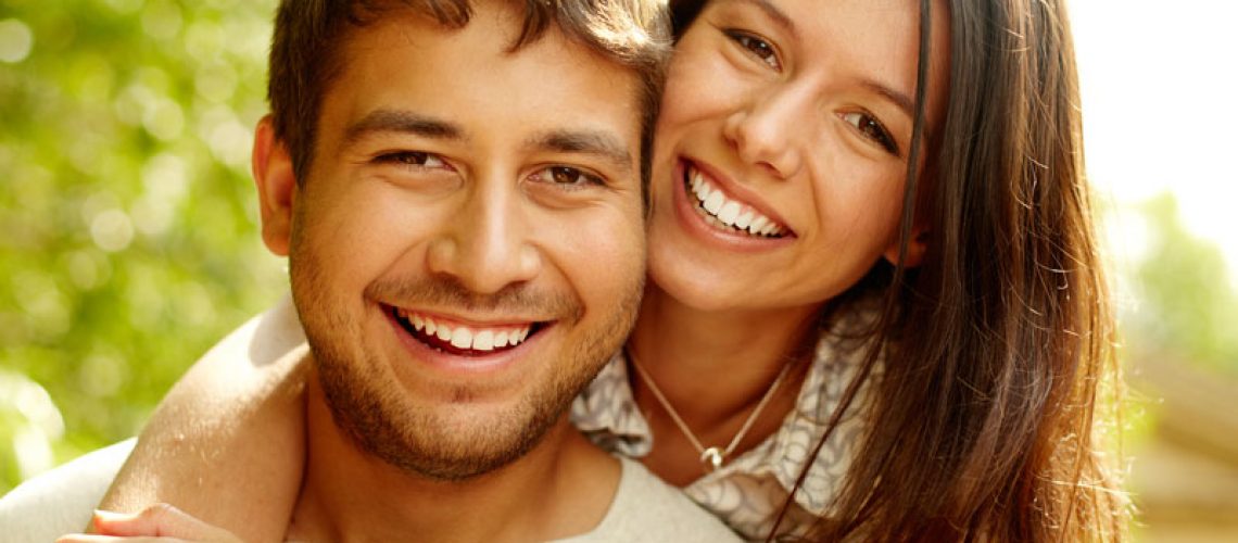 Dental Patients Smiling With Well Cared For Dental Implants In Williamsville, NY